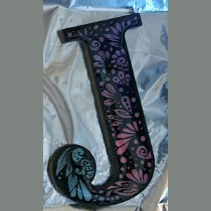Painted 8 in letter coated in resin